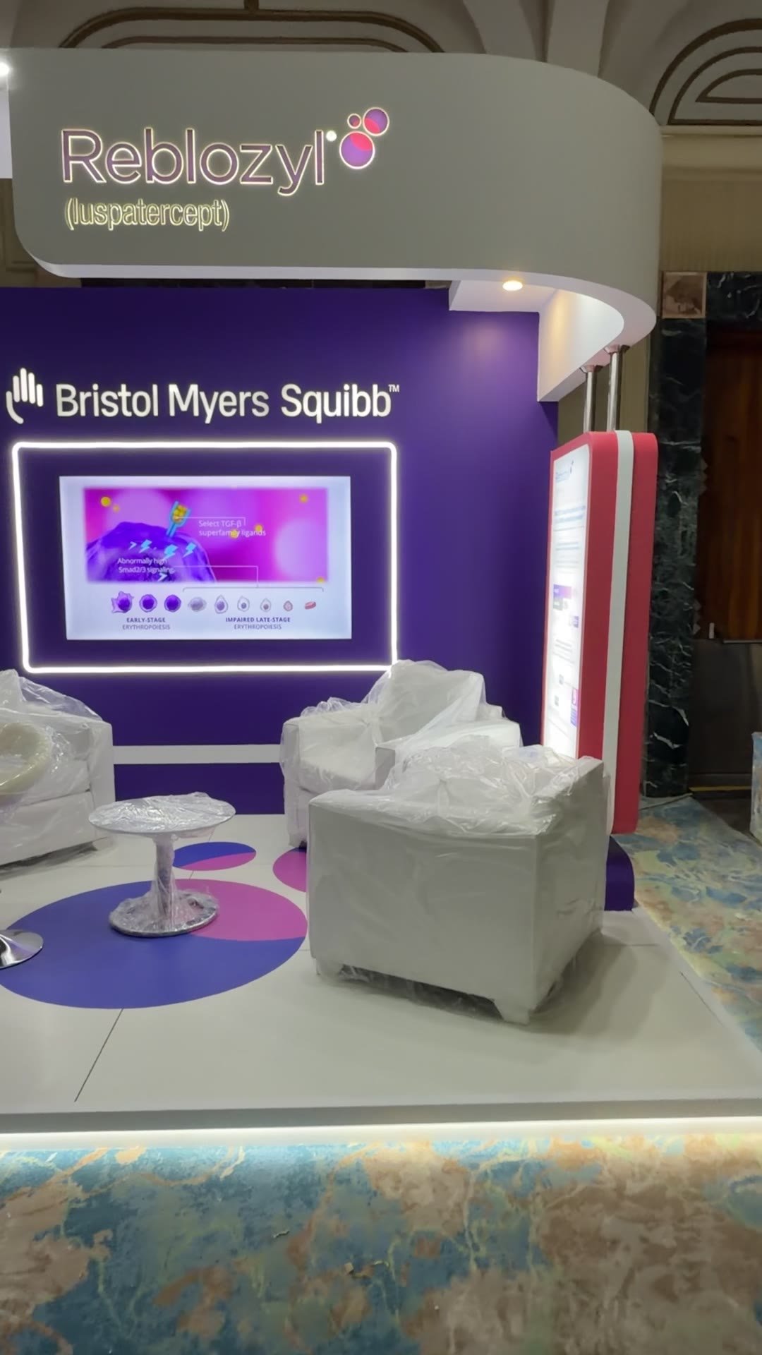 Consultation lounge inside a medical exhibition booth built by Reema